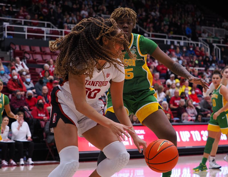 Jan 29, 2023; Stanford, California, USA; Stanford Cardinal guard Haley Jones (30) controls the ball against Oregon Ducks center Phillipina Kyei (15) during the third quarter at Maples Pavilion. Mandatory Credit: Kelley L Cox-USA TODAY Sports