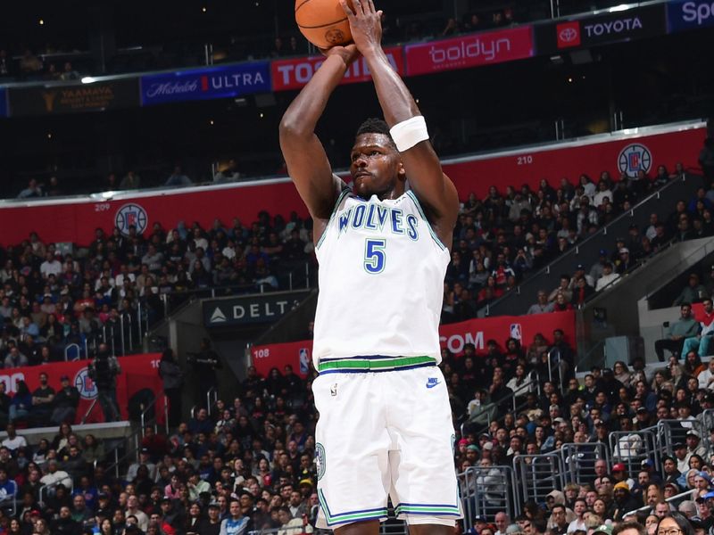 LOS ANGELES, CA - FEBRUARY 12:  Anthony Edwards #5 of the Minnesota Timberwolves shoots a three point basket during the game  on February 12, 2024 at Crypto.Com Arena in Los Angeles, California. NOTE TO USER: User expressly acknowledges and agrees that, by downloading and/or using this Photograph, user is consenting to the terms and conditions of the Getty Images License Agreement. Mandatory Copyright Notice: Copyright 2024 NBAE (Photo by Adam Pantozzi/NBAE via Getty Images)