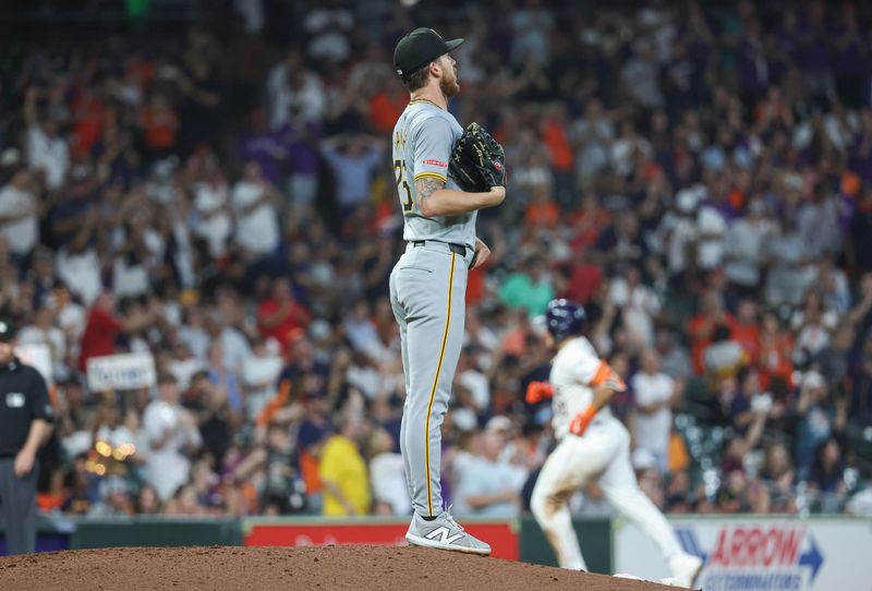 Jul 30, 2024; Houston, Texas, USA; Pittsburgh Pirates starting pitcher Mitch Keller (23) reacts and Houston Astros catcher Yainer Diaz (21) rounds the bases after hitting a  home run during the fourth inning at Minute Maid Park. Mandatory Credit: Troy Taormina-USA TODAY Sports