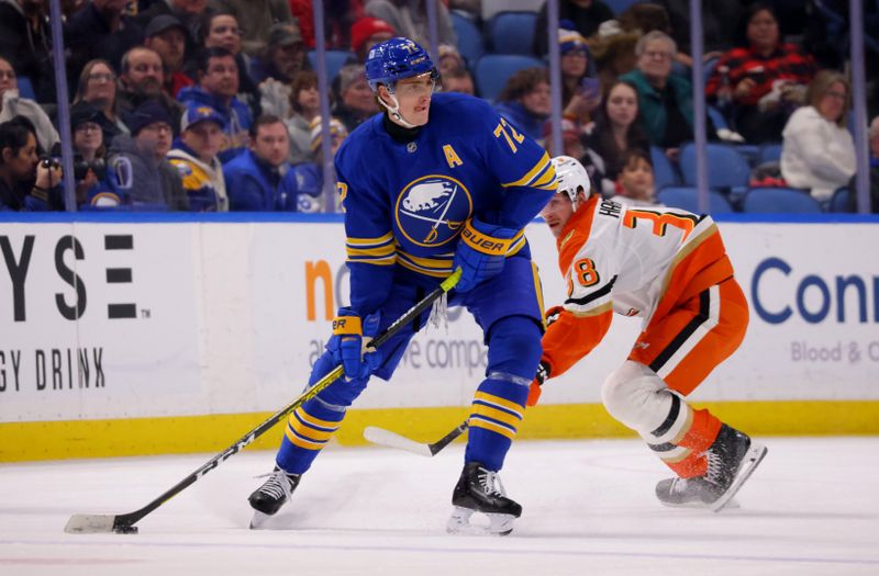 Feb 25, 2025; Buffalo, New York, USA;  Buffalo Sabres center Tage Thompson (72) looks to make a pass as Anaheim Ducks center Jansen Harkins (38) defends during the first period at KeyBank Center. Mandatory Credit: Timothy T. Ludwig-Imagn Images