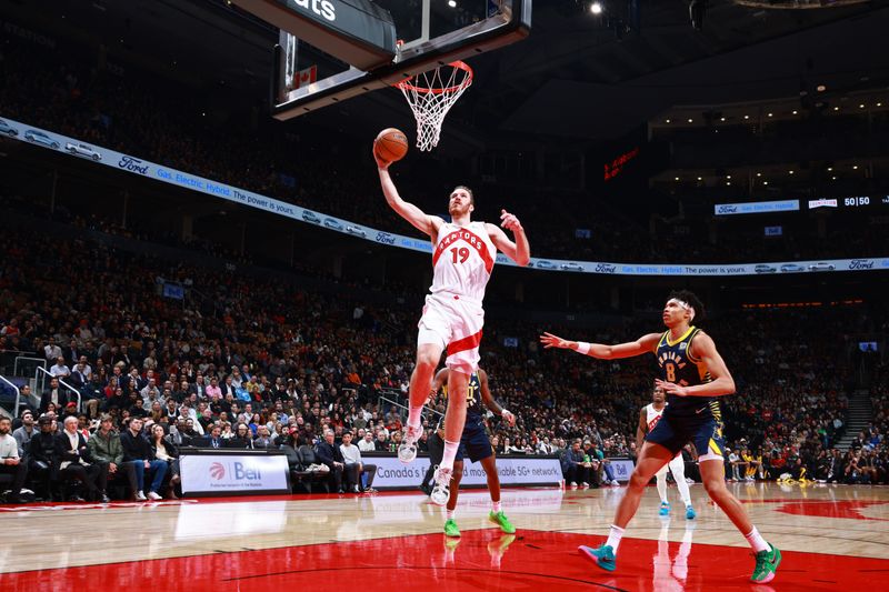 TORONTO, CANADA - NOVEMBER 18: Jakob Poeltl #19 of the Toronto Raptors dunks the ball during the game against the Indiana Pacers on November 18, 2024 at the Scotiabank Arena in Toronto, Ontario, Canada.  NOTE TO USER: User expressly acknowledges and agrees that, by downloading and or using this Photograph, user is consenting to the terms and conditions of the Getty Images License Agreement.  Mandatory Copyright Notice: Copyright 2024 NBAE (Photo by Vaughn Ridley/NBAE via Getty Images)