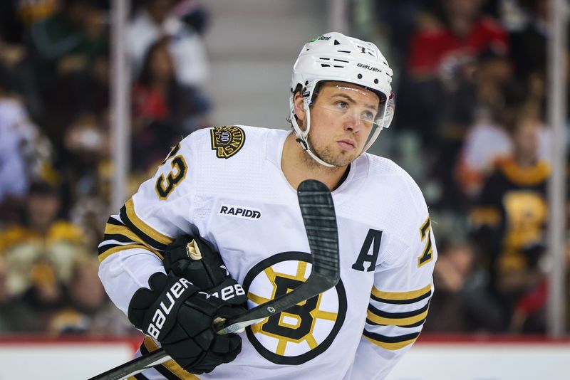 Feb 22, 2024; Calgary, Alberta, CAN; Boston Bruins defenseman Charlie McAvoy (73) against the Calgary Flames during the second period at Scotiabank Saddledome. Mandatory Credit: Sergei Belski-USA TODAY Sports