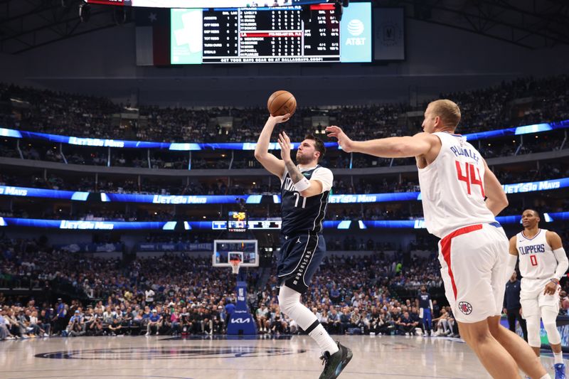 DALLAS, TX - APRIL 28: Luka Doncic #77 of the Dallas Mavericks shoots the ball during the game against the LA Clippers during Round 1 Game 4 of the 2024 NBA Playoffs on April 28, 2024 at the American Airlines Center in Dallas, Texas. NOTE TO USER: User expressly acknowledges and agrees that, by downloading and or using this photograph, User is consenting to the terms and conditions of the Getty Images License Agreement. Mandatory Copyright Notice: Copyright 2024 NBAE (Photo by Tim Heitman/NBAE via Getty Images)