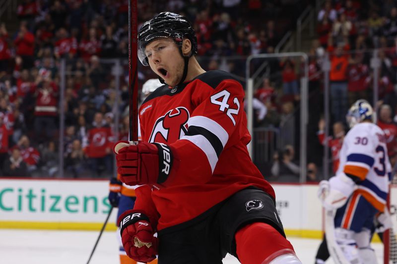 Oct 25, 2024; Newark, New Jersey, USA; New Jersey Devils center Curtis Lazar (42) celebrates his goal against the New York Islanders during the second period at Prudential Center. Mandatory Credit: Ed Mulholland-Imagn Images