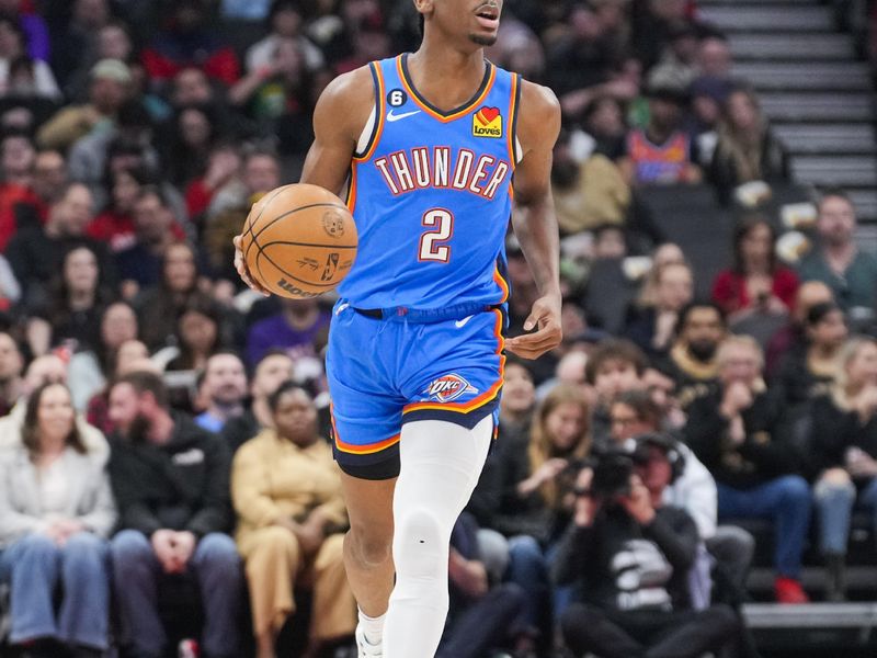 TORONTO, ON - MARCH 16: Shai Gilgeous-Alexander #2 of the Oklahoma City Thunder dribbles against the Toronto Raptors during the first half of their basketball game at the Scotiabank Arena on March 16, 2023 in Toronto, Ontario, Canada. NOTE TO USER: User expressly acknowledges and agrees that, by downloading and/or using this Photograph, user is consenting to the terms and conditions of the Getty Images License Agreement. (Photo by Mark Blinch/Getty Images)