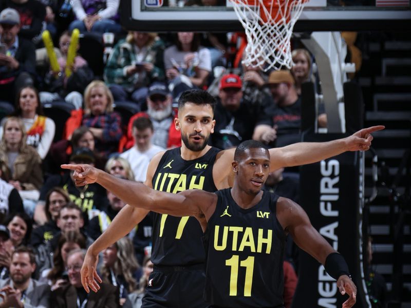 SALT LAKE CITY, UT - JANUARY 12: Kris Dunn #11 and Omer Yurtseven #77 of the Utah Jazz stand on the court during the game against the Toronto Raptors on January 12, 2024 at Delta Center in Salt Lake City, Utah. NOTE TO USER: User expressly acknowledges and agrees that, by downloading and or using this Photograph, User is consenting to the terms and conditions of the Getty Images License Agreement. Mandatory Copyright Notice: Copyright 2024 NBAE (Photo by Melissa Majchrzak/NBAE via Getty Images)