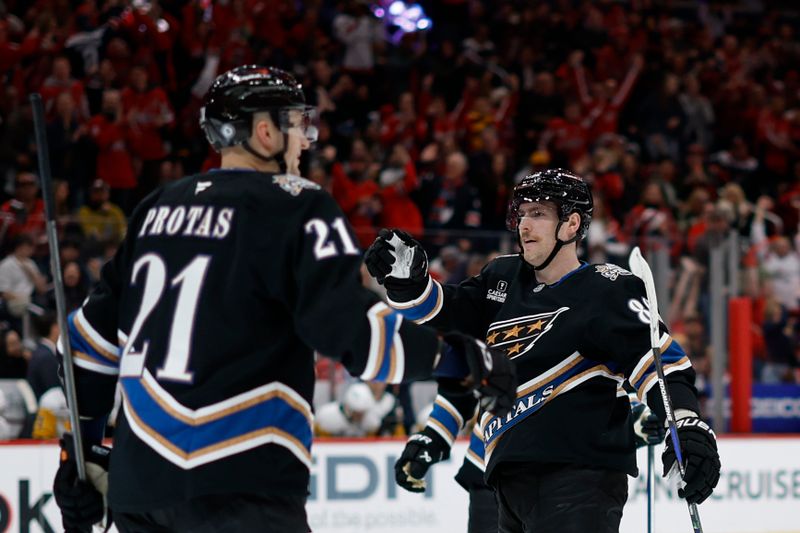 Jan 18, 2025; Washington, District of Columbia, USA; Washington Capitals left wing Pierre-Luc Dubois (80) celebrates after scoring a goal against the Pittsburgh Penguins in the third period at Capital One Arena. Mandatory Credit: Geoff Burke-Imagn Images