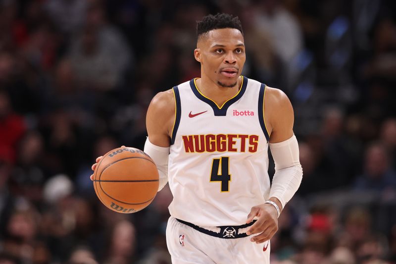 CHICAGO, ILLINOIS - JANUARY 27: Russell Westbrook #4 of the Denver Nuggets dribbles up the court against the Chicago Bulls during the first half at the United Center on January 27, 2025 in Chicago, Illinois. NOTE TO USER: User expressly acknowledges and agrees that, by downloading and or using this photograph, User is consenting to the terms and conditions of the Getty Images License Agreement.  (Photo by Michael Reaves/Getty Images)