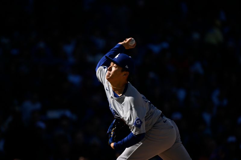 Apr 6, 2024; Chicago, Illinois, USA;  Los Angeles Dodgers pitcher Yoshinobu Yamamoto (18) delivers against the Chicago Cubs during the first inning at Wrigley Field. Mandatory Credit: Matt Marton-USA TODAY Sports