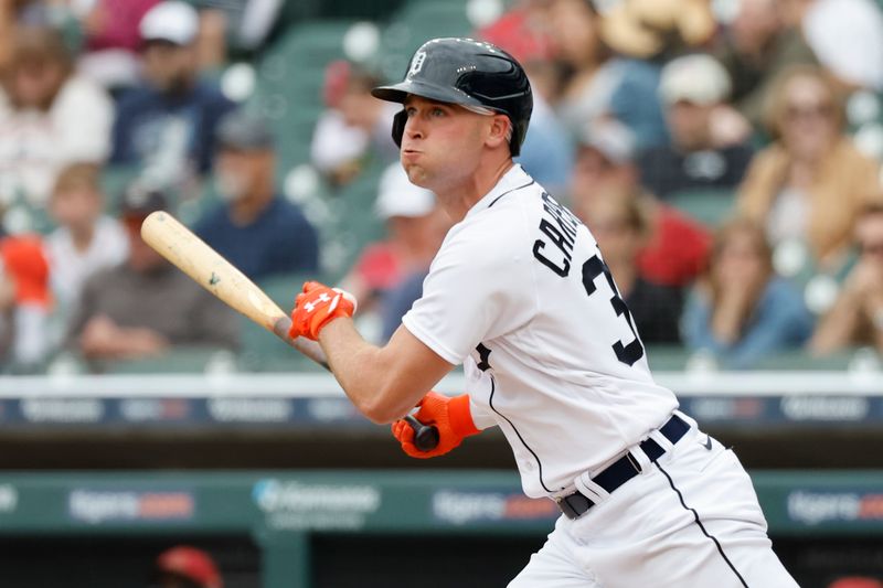 Jun 11, 2023; Detroit, Michigan, USA; Detroit Tigers right fielder Kerry Carpenter (30) hits a single in the first inning against the Arizona Diamondbacks at Comerica Park. Mandatory Credit: Rick Osentoski-USA TODAY Sports