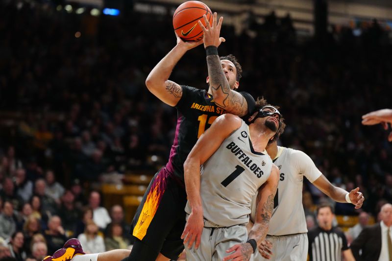 Feb 8, 2024; Boulder, Colorado, USA; Arizona State Sun Devils guard Jose Perez (12) shoots over Colorado Buffaloes guard J'Vonne Hadley (1) in the first half at the CU Events Center. Mandatory Credit: Ron Chenoy-USA TODAY Sports