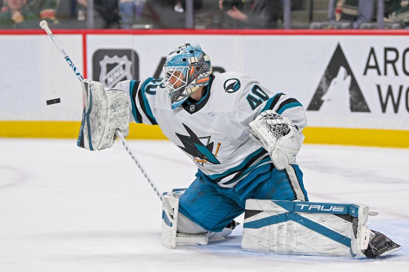 Apr 9, 2025; Saint Paul, Minnesota, USA;  San Jose Sharks goalie Alexandar Georgiev (40) makes a blocker save against the Minnesota Wild during the third period at Xcel Energy Center. Mandatory Credit: Nick Wosika-Imagn Images