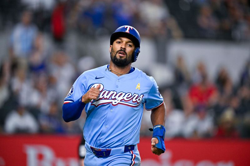 Sep 1, 2024; Arlington, Texas, USA; Texas Rangers second baseman Marcus Semien (2) scores against the Oakland Athletics during the tenth inning at Globe Life Field. Mandatory Credit: Jerome Miron-USA TODAY Sports