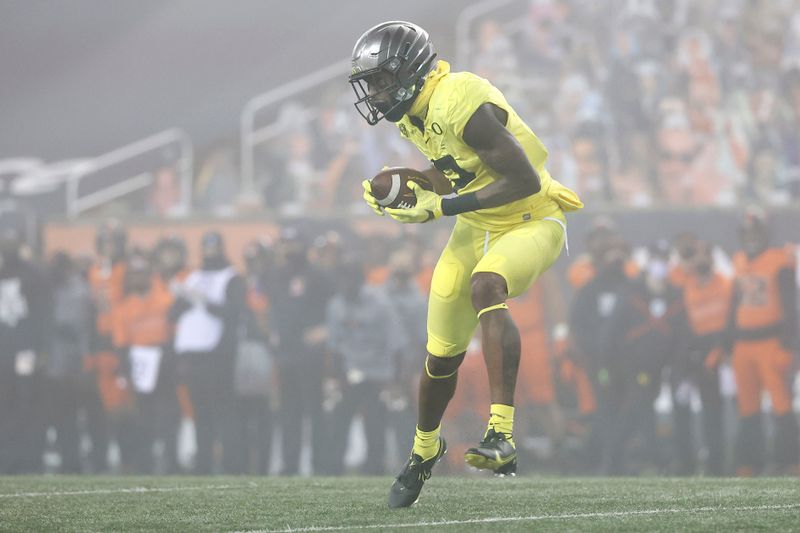 Nov 27, 2020; Corvallis, Oregon, USA; Oregon Ducks  wide receiver Devon Williams (2) runs the ball for a touchdown against the Oregon State Beavers during the first half at Reser Stadium. Mandatory Credit: Soobum Im-USA TODAY Sports