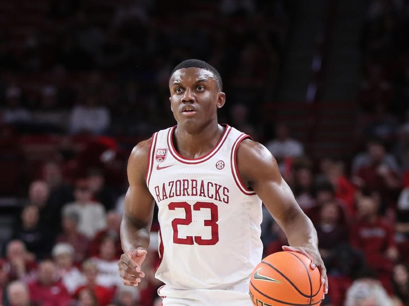 Nov 16, 2022; Fayetteville, Arkansas, USA; Arkansas Razorbacks guard Derrian Ford (23) dribbles during the second half against the South Dakota State Jackrabbits at Bud Walton Arena. Arkansas won 71-56. Mandatory Credit: Nelson Chenault-USA TODAY Sports