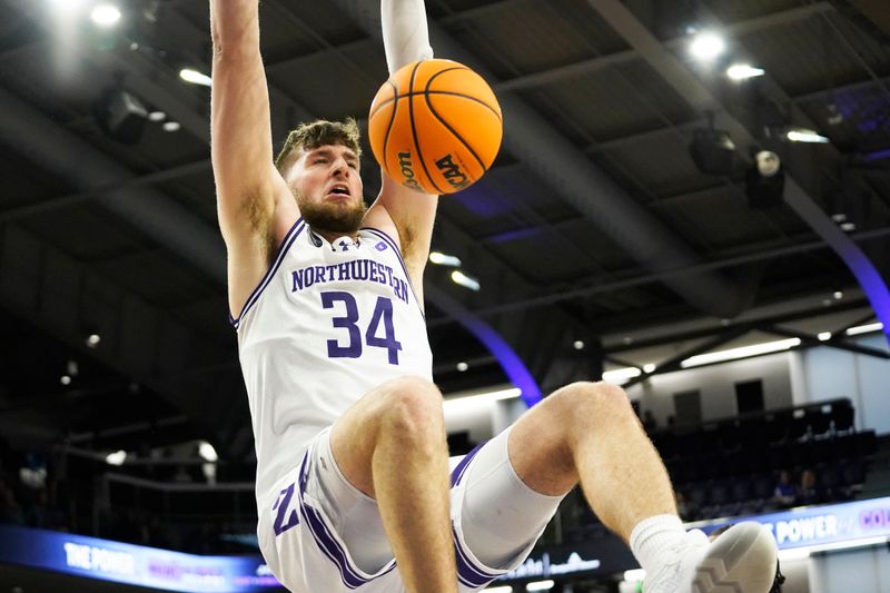 Dec 10, 2023; Evanston, Illinois, USA; Northwestern Wildcats center Matthew Nicholson (34) dunks the ball against the Detroit Mercy Titans during the second half at Welsh-Ryan Arena. Mandatory Credit: David Banks-USA TODAY Sports