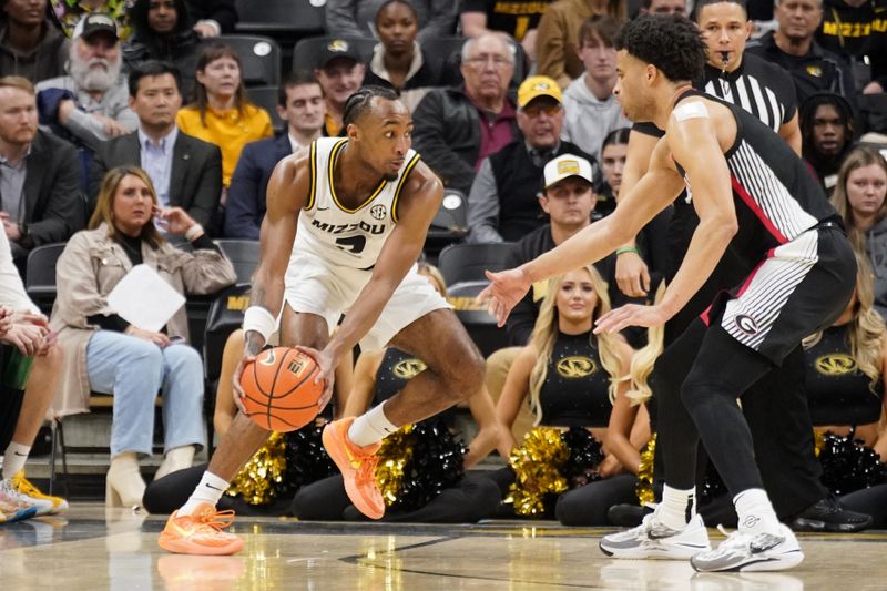 Jan 6, 2024; Columbia, Missouri, USA; Missouri Tigers guard Tamar Bates (2) dribbles the ball as Georgia Bulldogs guard Jabri Abdur-Rahim (1) defends during the second half at Mizzou Arena. Mandatory Credit: Denny Medley-USA TODAY Sports