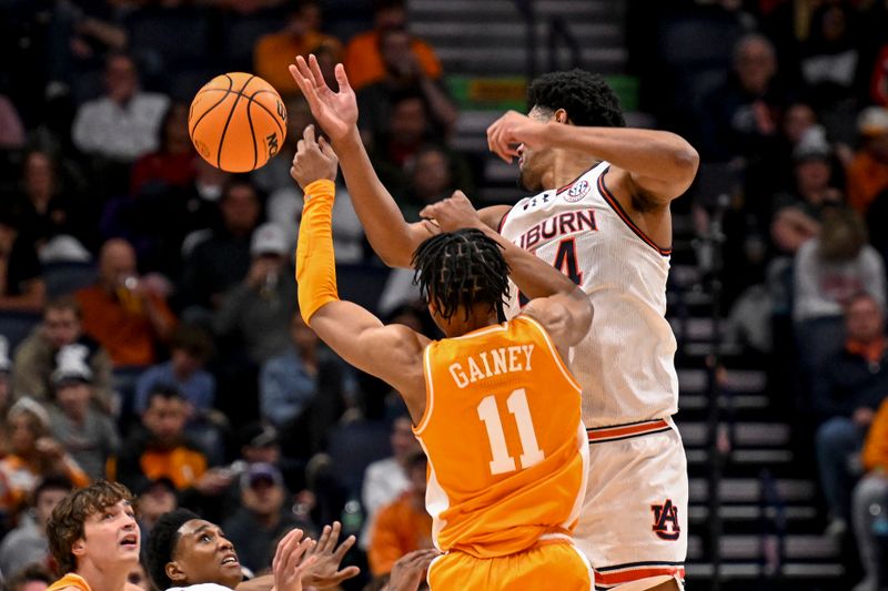 Mar 15, 2025; Nashville, TN, USA;  Auburn Tigers center Dylan Cardwell (44) blocks the shot of  Tennessee Volunteers guard Jordan Gainey (11) during the first half at Bridgestone Arena. Mandatory Credit: Steve Roberts-Imagn Images
