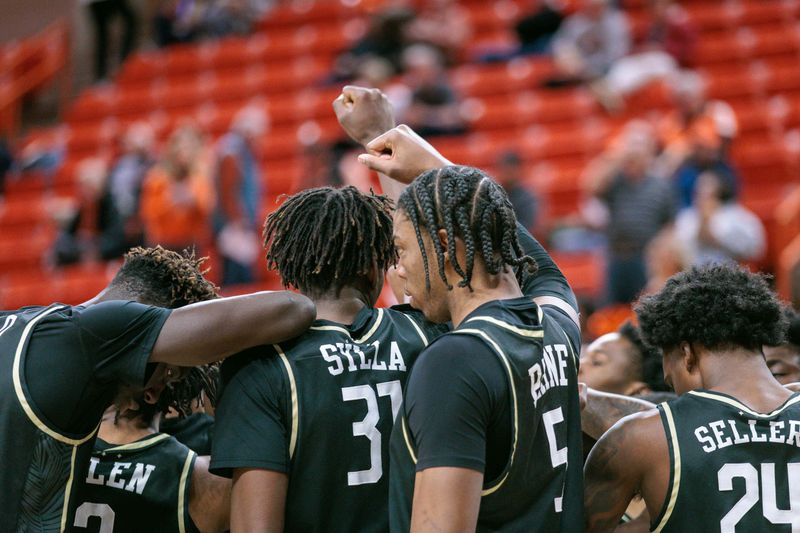 Feb 28, 2024; Stillwater, Oklahoma, USA; UCF Knights guard players huddle at Gallagher-Iba Arena. Mandatory Credit: William Purnell-USA TODAY Sports