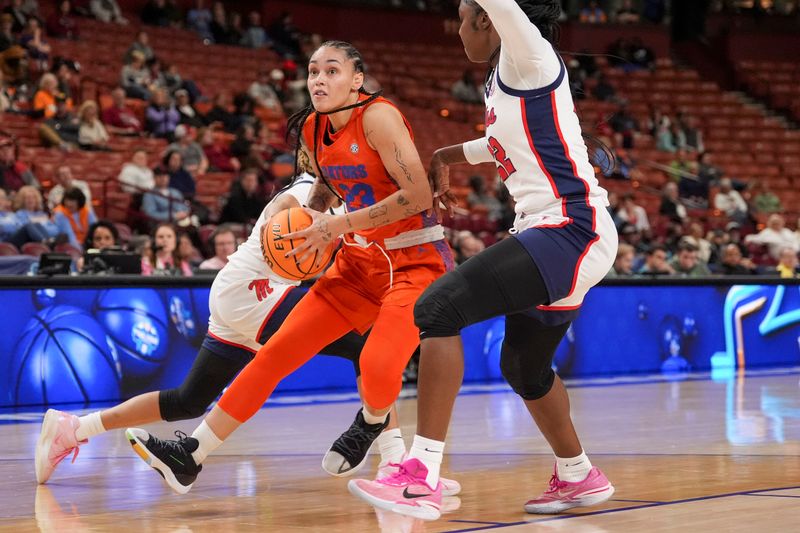 Mar 8, 2024; Greensville, SC, USA; Florida Gators guard Leilani Correa (23) looks to shoot covered by Ole Miss Rebels forward Tyia Singleton (22) during the second half at Bon Secours Wellness Arena. Mandatory Credit: Jim Dedmon-USA TODAY Sports