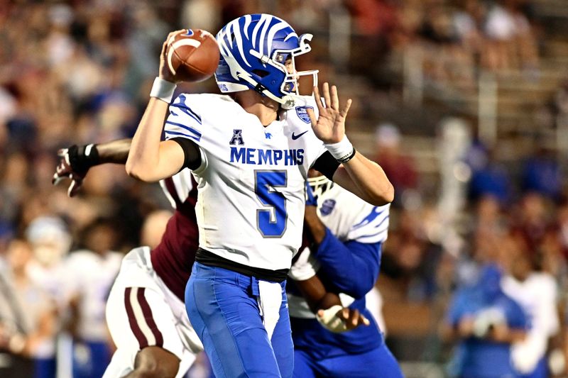 Sep 3, 2022; Starkville, Mississippi, USA; Memphis Tigers quarterback Seth Henigan (5) throws a pass against the Mississippi State Bulldogs during the fourth quarter at Davis Wade Stadium at Scott Field. Mandatory Credit: Matt Bush-USA TODAY Sports