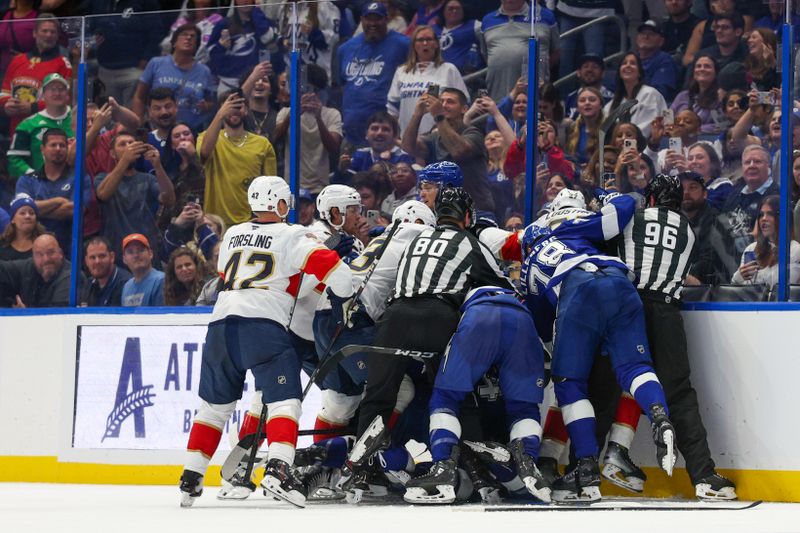 Oct 2, 2025; Tampa, Florida, USA; the Tampa Bay Lightning and Florida Panthers break out in a fight in the second period at Benchmark International Arena. Mandatory Credit: Nathan Ray Seebeck-Imagn Images