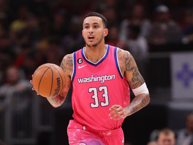 CHICAGO, ILLINOIS - FEBRUARY 26: Kyle Kuzma #33 of the Washington Wizards dribbles up the court against the Chicago Bulls during the first half at United Center on February 26, 2023 in Chicago, Illinois. NOTE TO USER: User expressly acknowledges and agrees that, by downloading and or using this photograph, User is consenting to the terms and conditions of the Getty Images License Agreement.  (Photo by Michael Reaves/Getty Images)