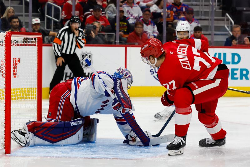 Oct 17, 2024; Detroit, Michigan, USA;  New York Rangers goaltender Jonathan Quick (32) makes a save on Detroit Red Wings defenseman Simon Edvinsson (77) in the second period at Little Caesars Arena. Mandatory Credit: Rick Osentoski-Imagn Images