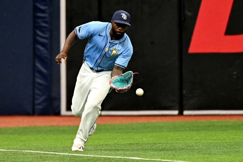 May 26, 2024; St. Petersburg, Florida, USA; Tampa Bay Rays left fielder Randy Arozarena (56) fields the ball in the second inning against the Kansas City Royals at Tropicana Field. Mandatory Credit: Jonathan Dyer-USA TODAY Sports