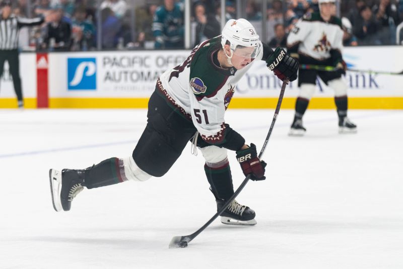 Dec 21, 2023; San Jose, California, USA; Arizona Coyotes defenseman Troy Stecher (51) shoots the puck during the third period against the San Jose Sharks at SAP Center at San Jose. Mandatory Credit: Stan Szeto-USA TODAY Sports