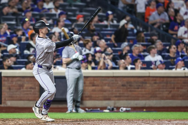 Jul 12, 2024; New York City, New York, USA;  Colorado Rockies center fielder Brenton Doyle (9) hits a two run home run in the eighth inning against the New York Mets at Citi Field. Mandatory Credit: Wendell Cruz-USA TODAY Sports