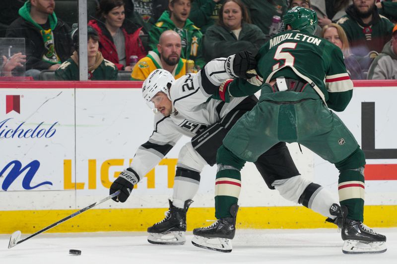 Feb 21, 2023; Saint Paul, Minnesota, USA; Minnesota Wild defenseman Jake Middleton (5) checks Los Angeles Kings left wing Kevin Fiala (22) in the first period at Xcel Energy Center. Mandatory Credit: Matt Blewett-USA TODAY Sports