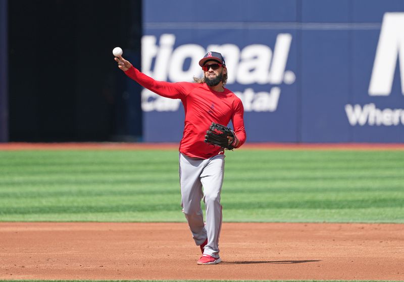 Aug 25, 2024; Toronto, Ontario, CAN; Los Angeles Angels shortstop Jack Lopez (10) throws a ball to fist base during batting practice before a game against theToronto Blue Jays at Rogers Centre. Mandatory Credit: Nick Turchiaro-USA TODAY Sports