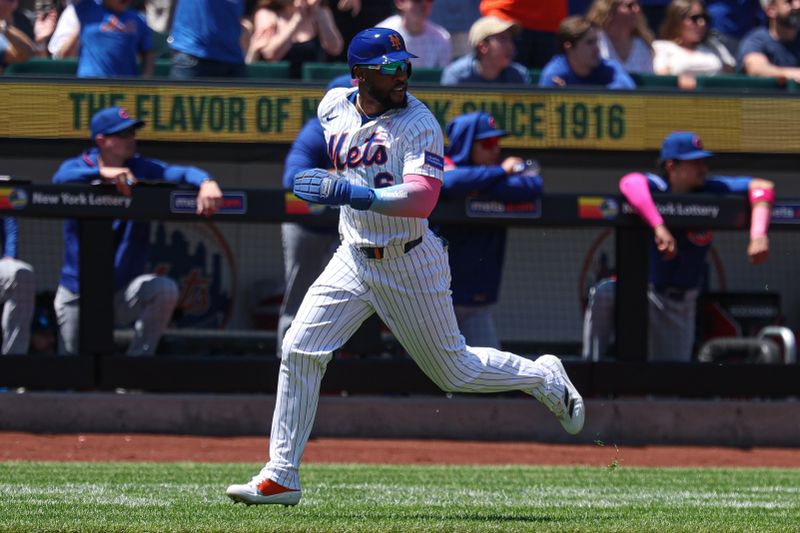 May 11, 2025; New York City, New York, USA; New York Mets designated hitter Starling Marte (6) scores a run on a triple by catcher Luis Torrens (not pictured) during the second inning against the Chicago Cubs at Citi Field. Mandatory Credit: Vincent Carchietta-Imagn Images