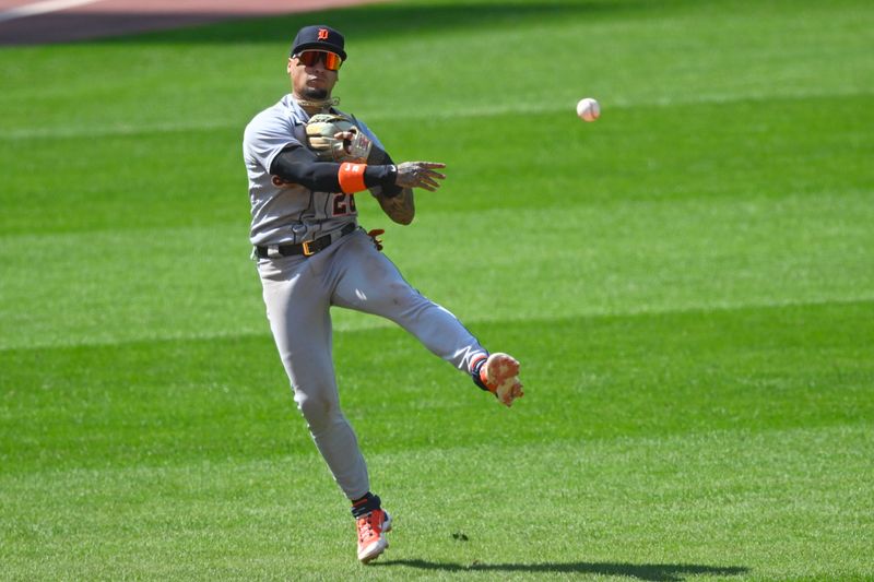 Aug 20, 2023; Cleveland, Ohio, USA; Detroit Tigers shortstop Javier Baez (28) throws to first base in the seventh inning against the Cleveland Guardians at Progressive Field. Mandatory Credit: David Richard-USA TODAY Sports