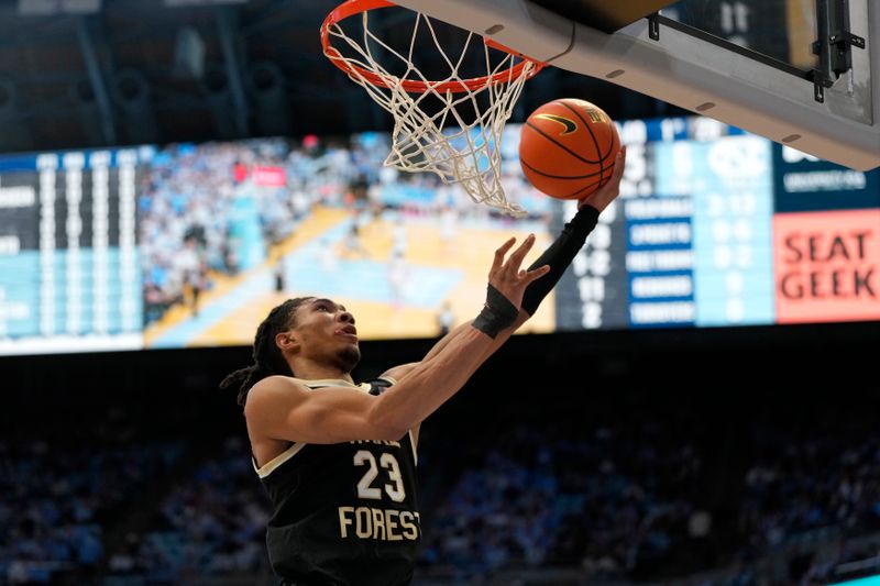 Jan 22, 2024; Chapel Hill, North Carolina, USA;  Wake Forest Demon Deacons guard Hunter Sallis (23) scores in the first half at Dean E. Smith Center. Mandatory Credit: Bob Donnan-USA TODAY Sports