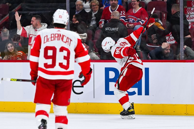 Dec 2, 2023; Montreal, Quebec, CAN; Detroit Red Wings defenseman Jake Walman (96) celebrates his game winning goal against the Montreal Canadiens in overtime at Bell Centre. Mandatory Credit: David Kirouac-USA TODAY Sports