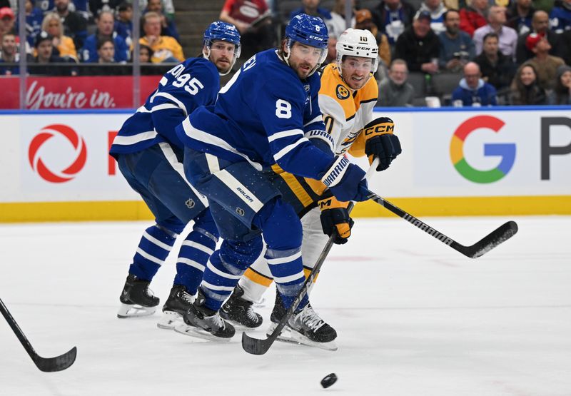 Dec 4, 2024; Toronto, Ontario, CAN;  Toronto Maple Leafs defenseman Chris Tanev (8) and Nashville Predators forward Colton Sissons (10) pursue a loose puck in the second period at Scotiabank Arena. Mandatory Credit: Dan Hamilton-Imagn Images