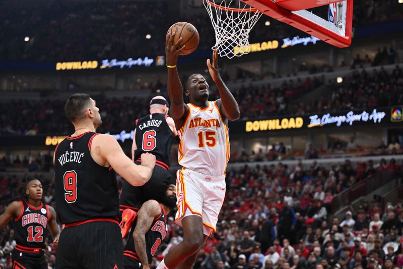 CHICAGO, ILLINOIS - APRIL 17:  Clint Capela #15 of the Atlanta Hawks drives to the basket in the first half against the Chicago Bulls during the play-in tournament on April 17, 2024 at United Center in Chicago, Illinois. NOTE TO USER: User expressly acknowledges and agrees that, by downloading and or using this photograph, User is consenting to the terms and conditions of the Getty Images License Agreement.  (Photo by Jamie Sabau/Getty Images)