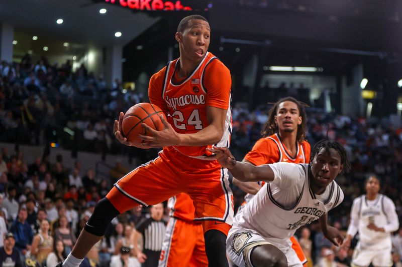 Feb 17, 2024; Atlanta, Georgia, USA; Syracuse Orange guard Quadir Copeland (24) grabs a rebound against the Georgia Tech Yellow Jackets in the second half at McCamish Pavilion. Mandatory Credit: Brett Davis-USA TODAY Sports