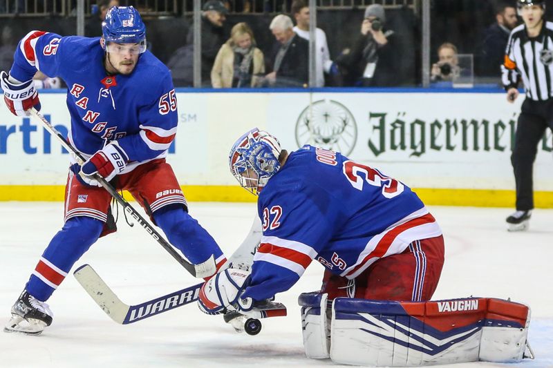 Feb 15, 2024; New York, New York, USA; New York Rangers goaltender Jonathan Quick (32) makes a save on a shot on goal attempt in the third period against the Montreal Canadiens at Madison Square Garden. Mandatory Credit: Wendell Cruz-USA TODAY Sports