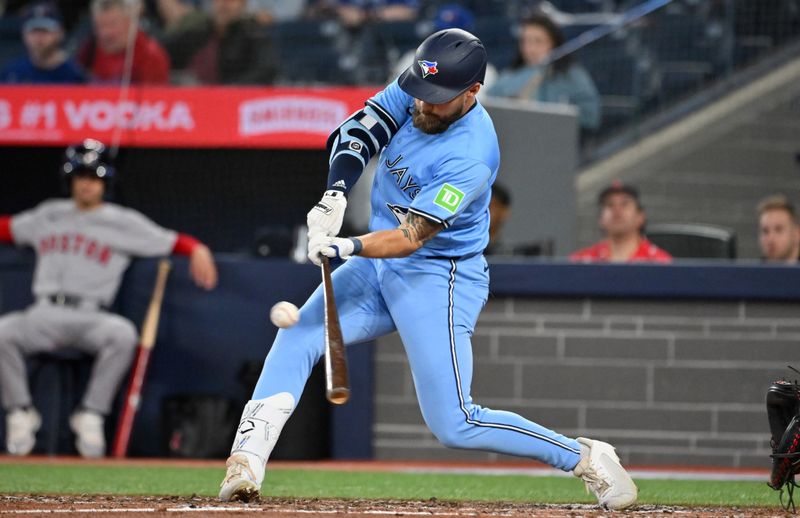 May 1, 2025; Toronto, Ontario, CAN;  Toronto Blue Jays right fielder Nathan Lukes (38) hits a single against the Boston Red Sox in the eighth inning at Rogers Centre. Mandatory Credit: Dan Hamilton-Imagn Images