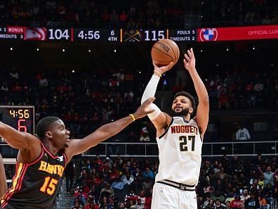 ATLANTA, GA - DECEMBER 11: Jamal Murray #27 of the Denver Nuggets shoots the ball during the game against the Atlanta Hawks  on December 11, 2023 at State Farm Arena in Atlanta, Georgia.  NOTE TO USER: User expressly acknowledges and agrees that, by downloading and/or using this Photograph, user is consenting to the terms and conditions of the Getty Images License Agreement. Mandatory Copyright Notice: Copyright 2023 NBAE (Photo by Scott Cunningham/NBAE via Getty Images)