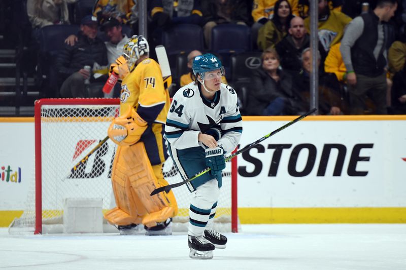 Mar 19, 2024; Nashville, Tennessee, USA; San Jose Sharks center Mikael Granlund (64) after a goal against Nashville Predators goaltender Juuse Saros (74) during the first period at Bridgestone Arena. Mandatory Credit: Christopher Hanewinckel-USA TODAY Sports