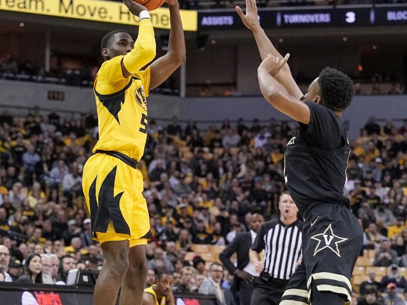 Jan 7, 2023; Columbia, Missouri, USA; Missouri Tigers guard D'Moi Hodge (5) shoots a three point shot as Vanderbilt Commodores guard Noah Shelby (2) defends during the first half at Mizzou Arena. Mandatory Credit: Denny Medley-USA TODAY Sports