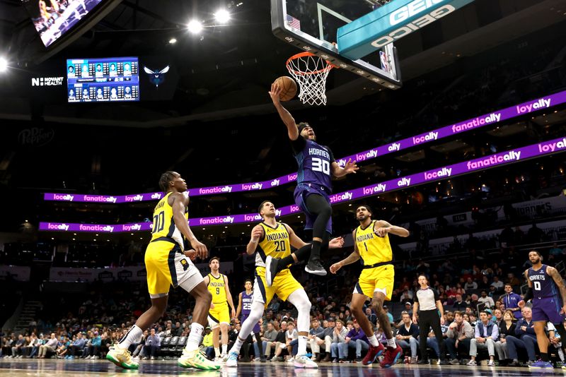 CHARLOTTE, NORTH CAROLINA - FEBRUARY 12: Seth Curry #30 of the Charlotte Hornets lays the ball up during the first half of an NBA game against the Indiana Pacers at Spectrum Center on February 12, 2024 in Charlotte, North Carolina. NOTE TO USER: User expressly acknowledges and agrees that, by downloading and or using this photograph, User is consenting to the terms and conditions of the Getty Images License Agreement. (Photo by David Jensen/Getty Images)