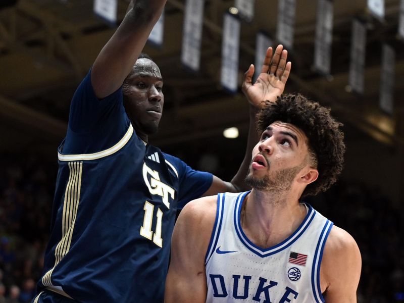 Dec 31, 2025; Durham, North Carolina, USA; Duke Blue Devils forward Cameron Boozer (12) looks to shoot as Georgia Tech Yellow Jackets forward Baye Ndongo (11) defends during the second half at Cameron Indoor Stadium.   The Blue Devils won 85-79.  Mandatory Credit: Rob Kinnan-Imagn Images