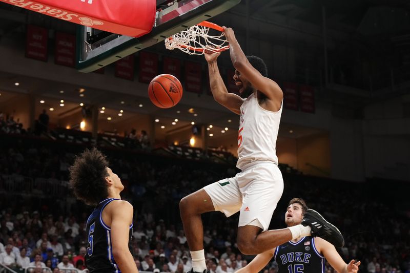 Feb 6, 2023; Coral Gables, Florida, USA; Miami Hurricanes guard Harlond Beverly (5) dunks the ball against the Duke Blue Devils during the second half at Watsco Center. Mandatory Credit: Jasen Vinlove-USA TODAY Sports