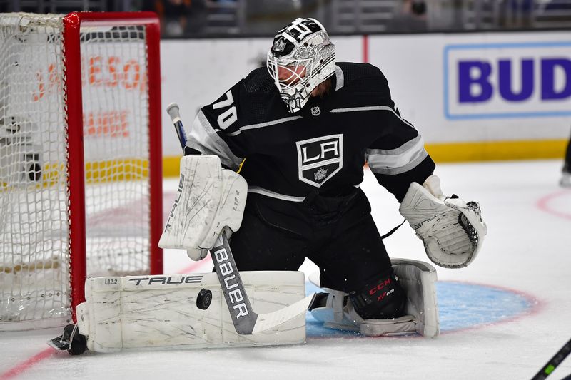 Apr 29, 2023; Los Angeles, California, USA; Los Angeles Kings goaltender Joonas Korpisalo (70) blocks a shot against the Edmonton Oilers during the first period in game six of the first round of the 2023 Stanley Cup Playoffs at Crypto.com Arena. Mandatory Credit: Gary A. Vasquez-USA TODAY Sports