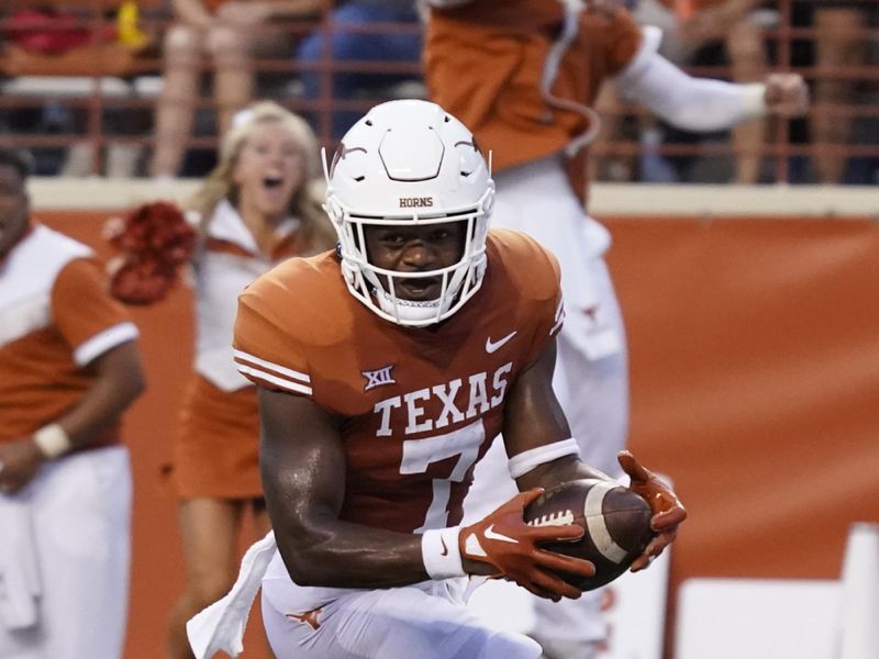 Sep 3, 2022; Austin, Texas, USA; Texas Longhorns defensive back B.J. Allen Jr. (7) runs in to the end zone for a touchdown after recovering a blocked punt against the Louisiana Monroe Warhawks in the first half at Darrell K Royal-Texas Memorial Stadium. Mandatory Credit: Scott Wachter-USA TODAY Sports